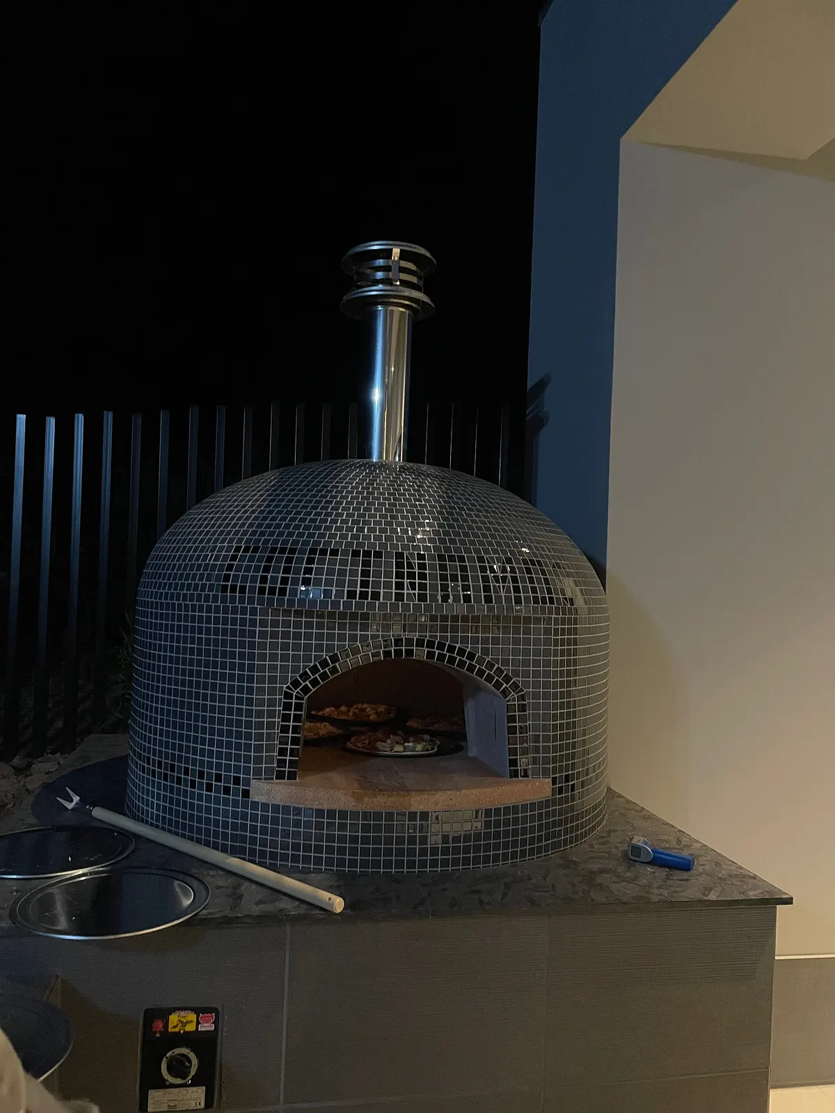 A tiled dome pizza oven